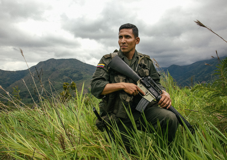 Photo The Rio Minero runs black with spoil mud from the emerald mines in Muzo, Boyacá. Right, a 