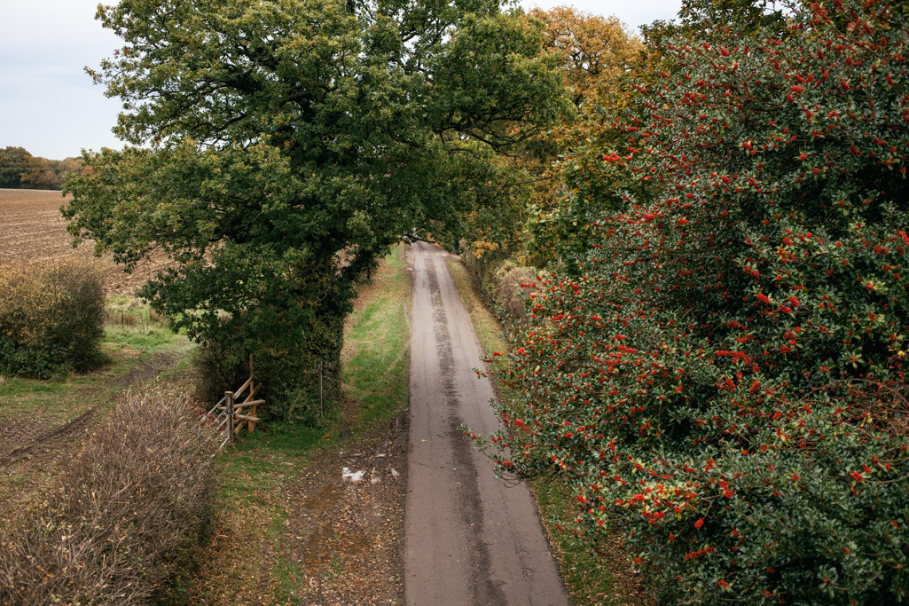 Photo Aerial views of the family farm. Holly berries abovel the lane.